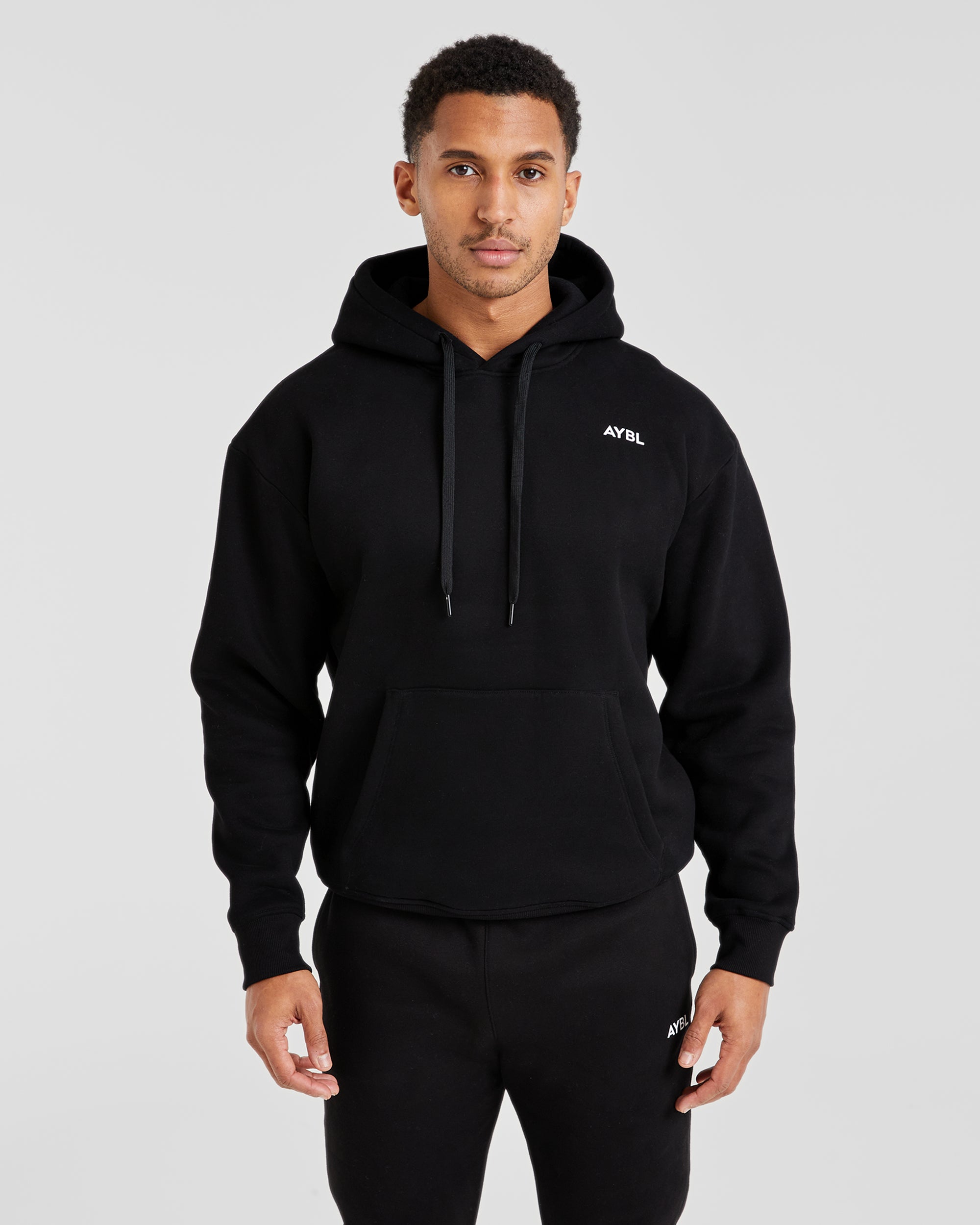 Essential Kapuzenpullover – Schwarz