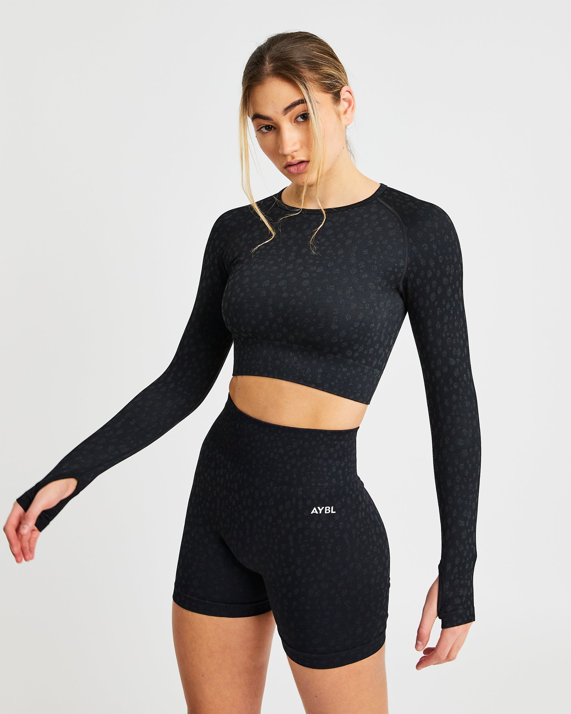 Evolve Speckle Seamless Langarm-Crop-Top – Schwarz