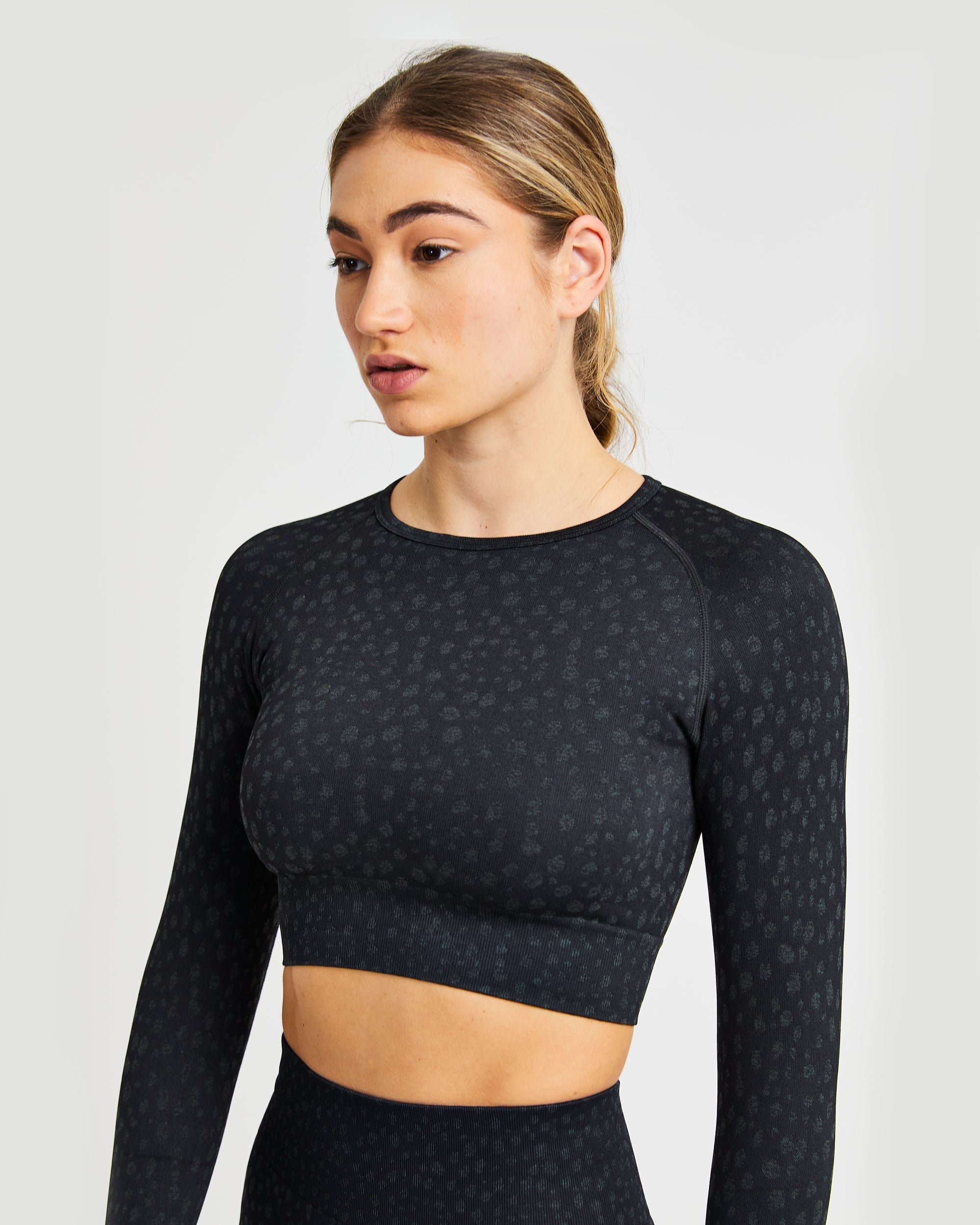 Evolve Speckle Seamless Langarm-Crop-Top – Schwarz
